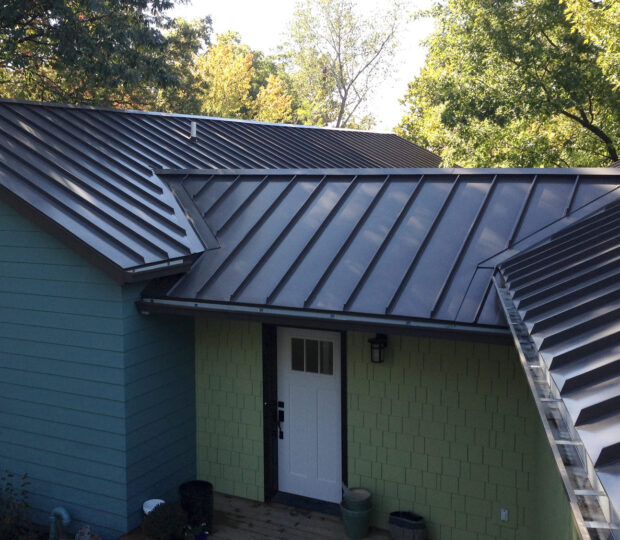 standing seam metal roof, gutters and down spouts