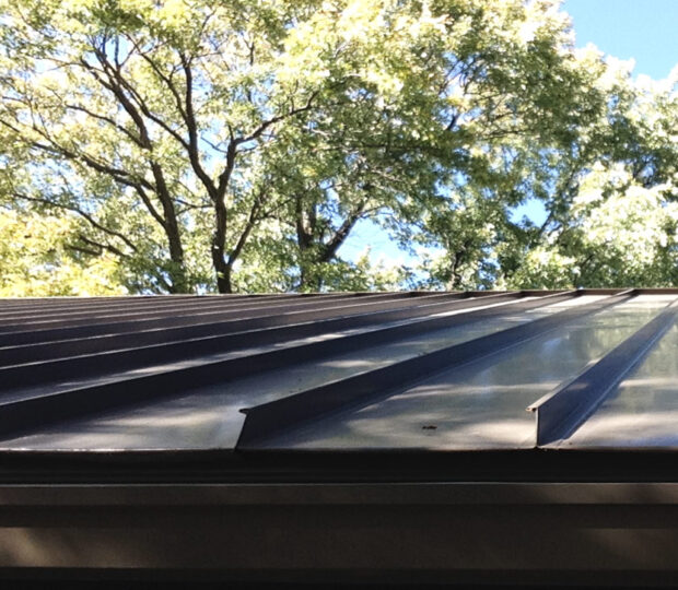 detail view of standing seam metal roof and gutter