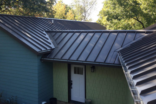 standing seam metal roof, gutters and down spouts
